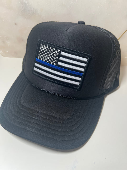 Back the Blue patch on black trucker. This patch also looks great on other colors!