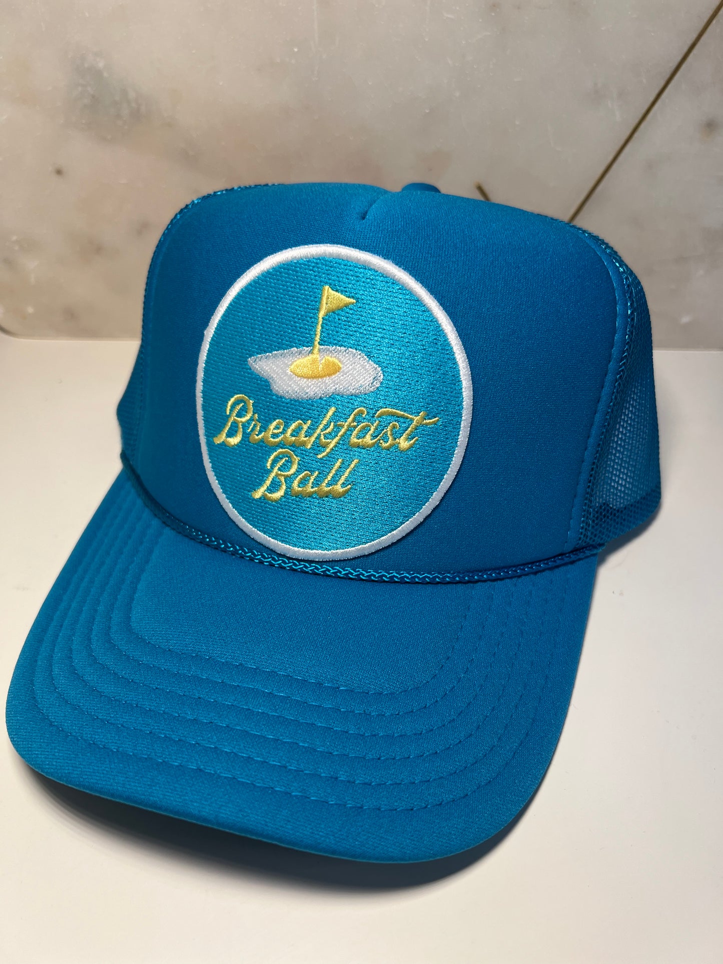 Blue Breakfast Ball on Blue Trucker